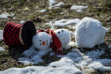 Melted snowman as a symbol of warm winter spring. Winter and spring seasons change. Melting snowman...
