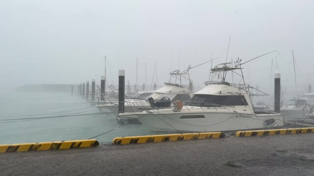 Hurricane Force Winds And Rain Batter Boats Sheltering In Harbor - Khanun