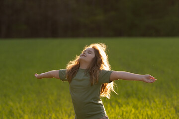 Obraz premium Carefree of dreaming child. Kid enjoying carefree and freedom. Kid meditation in nature. Dreams of kids carefree. Peaceful carefree child portrait. Kids peace and freedom. Mind and calm kid.