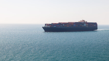 container ship carrying goods for international import export, business and industry regarding...