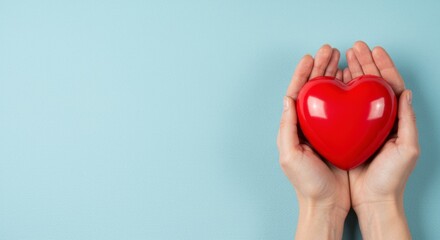 Obraz premium Heartfelt gesture of love hands holding a red heart symbol indoor setting close-up shot emotional connection