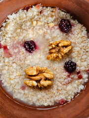 Oatmeal with nuts and blackberries