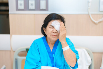 Elderly Woman with eye protective shield after eye surgery. Eye disease, Cataract,  Glaucoma, Age...