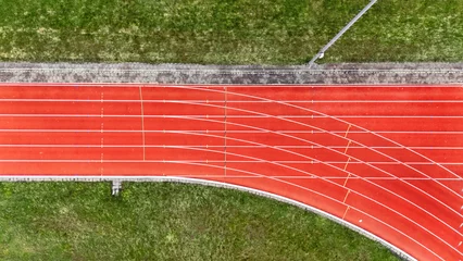 Fotobehang Gymnastiek Running track aerial drone view background from above, athletic stadium with track lines bird’s view, sport and fitness infrastructure in the Netherlands  © Iuliia Sokolovska