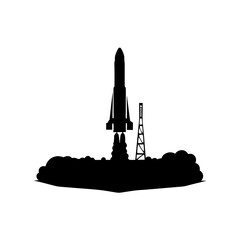 Silhouette of a rocket launching with smoke clouds and exhaust on a launch pad