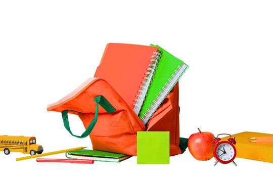 Colorful school supplies next to a backpack on white, isolated on white, PNG