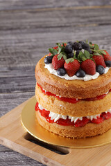creamy naked cake with berries topping