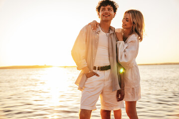 Smiling beautiful woman and her handsome boyfriend. Excited couple in casual clothes. Happy...