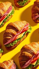 Close-up of gourmet croissant sandwiches with crispy layers, salami, lettuce, tomato, and cheese on a vibrant yellow background. Warm, cinematic lighting highlights mouthwatering textures