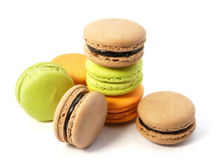 Pile of macaron cookies in various flavours and colours isolated on white background.