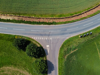 Aerial view of bend and junction on minor rural road