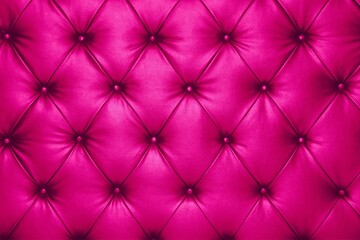 Obraz premium Close up of a vibrant pink tufted fabric with diamond pattern and buttons