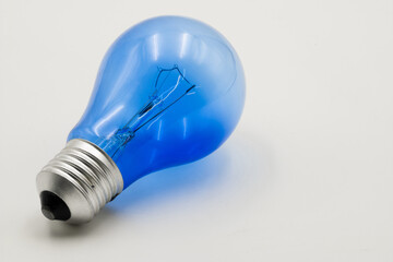 Unique blue electric light bulb captures attention with its vibrant color and modern design