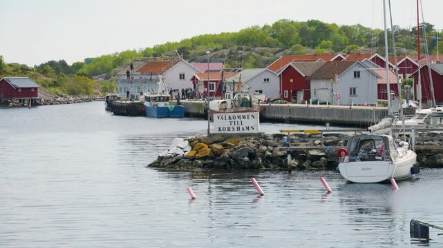 Welcome To Korshamn Signage In Swedish At The Harbor On Norwegian Border Near Bohuslan In West Sweden. wide shot