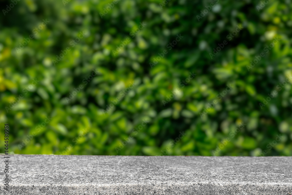 Aufkleber Stone table summer display with blurred green leaves background. Product placement display minimalistic template for products and advertisement. Nature summer table podium mock up stone countertop
