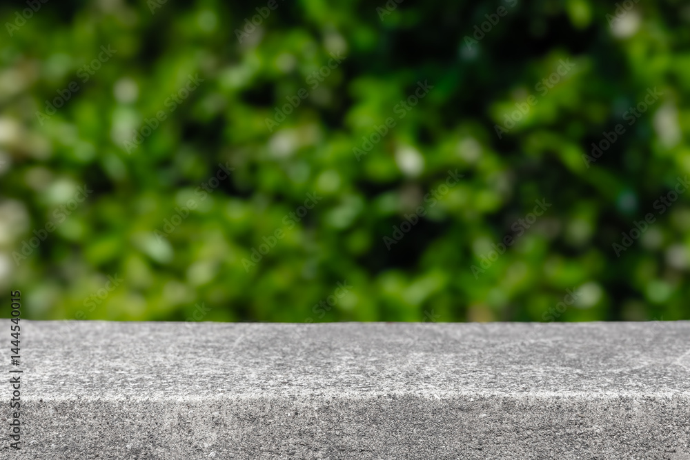 Poster Stone table summer display with blurred green leaves background. Product placement display minimalistic template for products and advertisement. Nature summer table podium mock up stone countertop