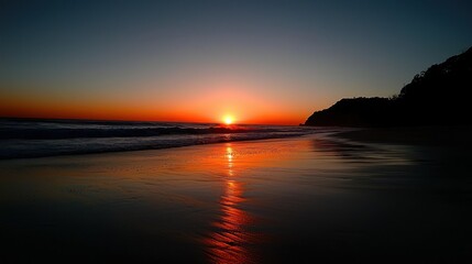 Naklejka premium The beautiful sunset over the ocean and sandy beach is stunning