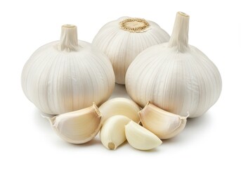 Still life of three garlic bulbs and several cloves of garlic on a white background surface view
