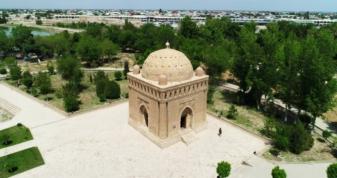 Drone flies around Ismoil Somoniy madrasah on a sunny day. Uzbekistan, Bukhara.