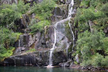 Waterfall on the coast in Trollfjord, Norway