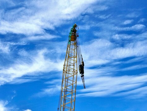 Tower Crane top with cloudy sky background