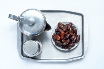 Dates Fruit And Tea Set On Wooden Table. Preparation For Breakfasting On Iftar Time At Ramadan Month.