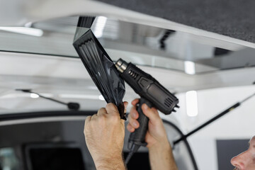 Process remove protective tint film from car. Transparent protection for window vs sun.