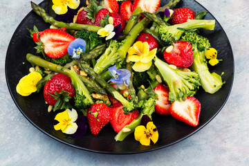 Vegetable salad with strawberries.