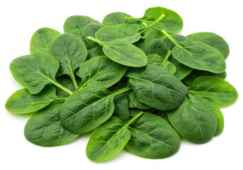 A close up shot of a pile of fresh green spinach leaves on a white surface in a studio setting
