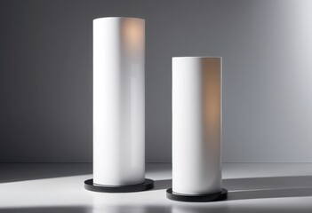 A stylish arrangement featuring two elegant white lamps stacked atop one another, showcasing their sleek design and soft glow, perfect for modern decor.
