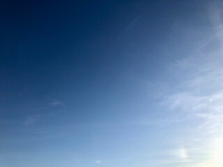 Fototapeta premium blue gradient of magical sky with traces of light clouds