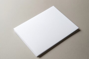 Blank textured white paper on a neutral background, ideal for design or crafting projects