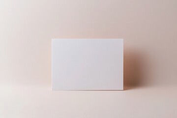Blank white card on soft pastel background, ideal for mockups or creative presentations