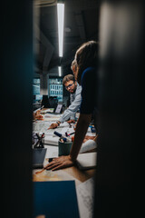 Diverse business colleagues collaborate on new project ideas at a modern office table. The...