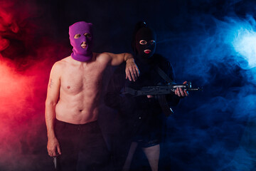Man And Woman Wearing Mask With Gun
