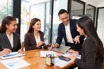Group of business people are having a presentation meeting in an office room.