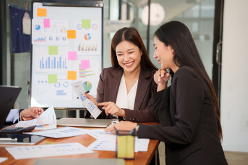 Group of Asian businessmen sitting and talking, consulting, discussing, having a meeting.