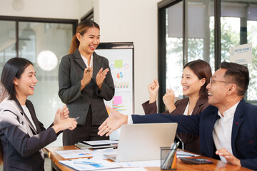 Group of Asian businessmen sitting and talking, consulting, discussing, having a meeting.