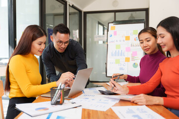 Group of business people are having a presentation meeting in an office room.
