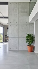 A modern concrete house in Mexico, designed by a renowned studio, features sleek lines, large windows, and a minimalist aesthetic, blending with the landscape.