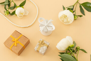 Women gift set with costume jewelry and peony flowers.