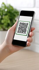 A hand scanning a QR code for payment, sharp focus on the phone, soft bokeh background.