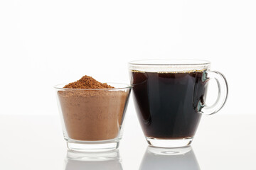 Coffee alternative. Chicory in powder and drink in glasses on a white background. 
