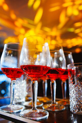 Family members gently holding a baby's feet during a special ceremony at home