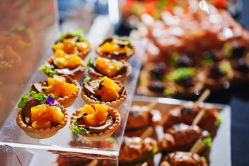 Culinary display of gourmet tarts featuring fresh fruits and herbs