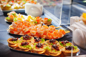 Delicious seafood and appetizers displayed at a vibrant event buffet