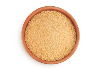 The brown sugar in ceramic bowl isolated on white background. Top view. Flat lay