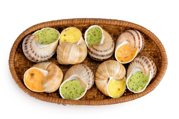 escargot snail filled with different fillings in a wicker basket isolated on white background. Top view. Flat lay