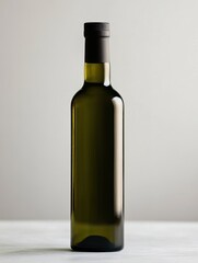 Olive oil bottle standing on light background