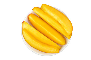 mango slices in ceramic bowl isolated on white background. Top view. Flat lay